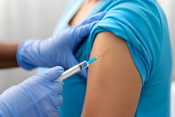Healthcare Action: Nurse Administering Vaccine to Patient in Clinical Setting, Close-Up Shot, Professional Environment, Medical Concept
