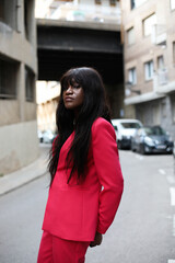 Vertical portrait of beautiful and young African American woman posing indoor. 