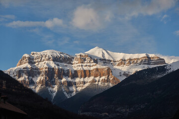 The snow-covered Mondarruego Walls in winter, rising majestically in the Ordesa and Monte Perdido National Park. A stunning frozen landscape in the Spanish Pyrenees