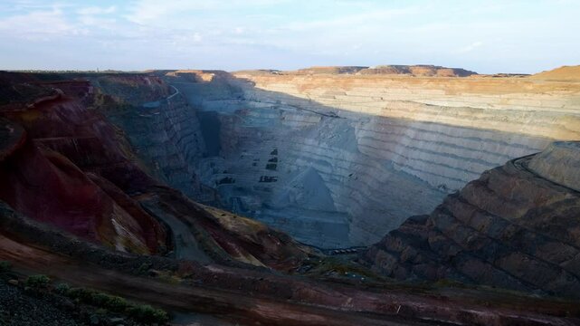 wide shot of the Kalgoorlie Boulder super pit from the lookout at sunset, mining city in western australia, Australia