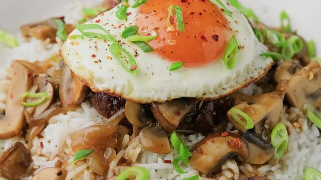 Hawaiian Loco Moco with hamburger, fried egg and brown mushroom gravy