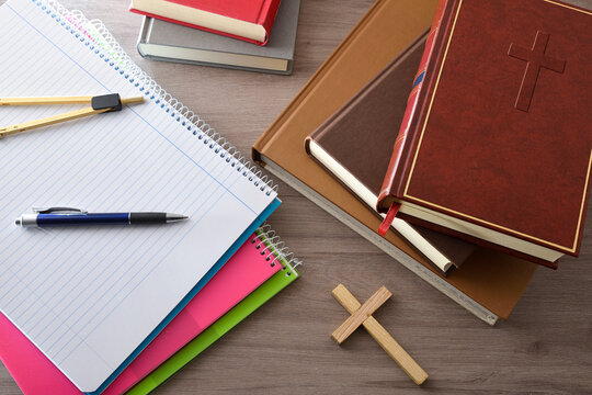 Religious education with notebooks books and a Bible top view