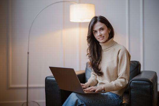 Woman Working on Laptop at Home