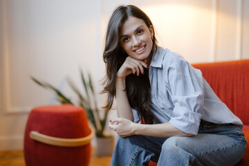 Portrait of a Smiling Woman in a Modern Space
