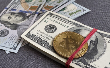  US Dollar bill bundles with bitcoins isolated on white background 