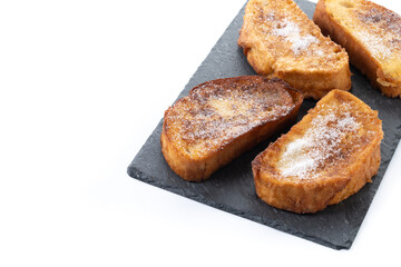 Traditional Spanish torrijas for Holy Week isolated on white background. Copy space