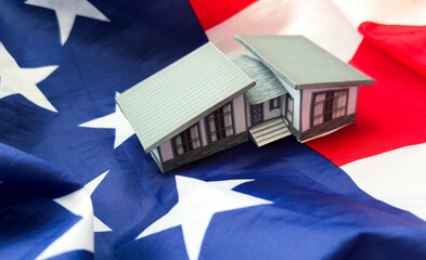 citizenship, residence, property, real estate and people concept - close up of living house model...