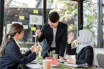 Dialogue and Progress. Professionals discussing sustainable practices and renewable technology in a workshop.