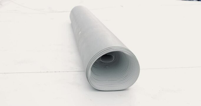 Pvc membrane roll rotating on white background