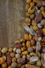 Beautiful assortment of colorful seeds arranged on wooden surface adding a touch of nature's artistry