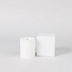 White candle and cube on a white background