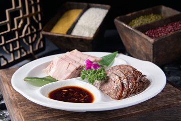 Delicious cold dish with dipping sauce and pressed pork elbow