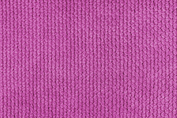 Texture of velour jacquard pink fabric coarse weave close up, macro woven coarse. Textile...