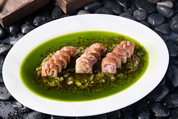 Sliced pork ear rolls with scallion oil