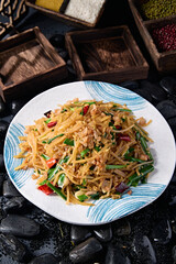 Fried shredded potatoes with chives, garlic slices, millet peppers