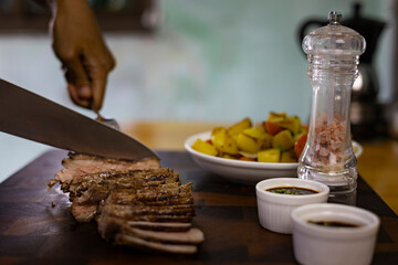 Slice The Beef Steak On A Wooden Cutting Board