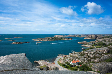 A breathtaking panoramic view of the Hunnebostrand archipelago on Sweden’s west coast, featuring...