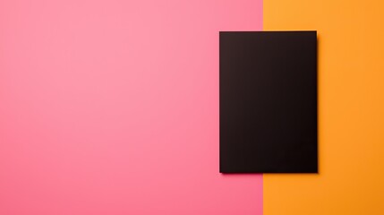 A minimalist image featuring a black canvas positioned between vibrant pink and orange backgrounds, creating a striking visual contrast.