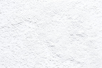 Obraz premium Thin layered white plaster wall texture with fine sand creates smooth, subtle surface ideal for various design applications. This versatile texture adds modern touch to interiors