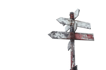 Old wooden signpost with multiple arrows pointing in directions