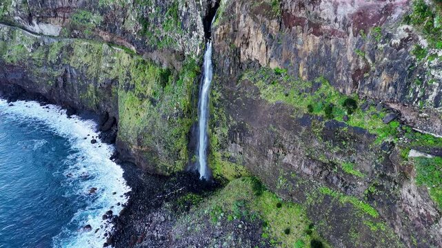 Top Down View of Veu da Noiva Waterfall Cascading Down the Rugged Cliff into the Atlantic Ocean, Madeira