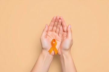 person holding an orange ribbon in their hands