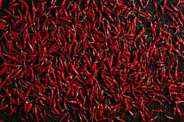 Fototapeta premium Abundance of red chili peppers filling frame. Neural network AI generated