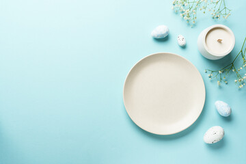 Easter table setting on blue.