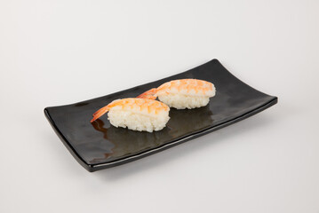 Ebi Nigiri Sushi with Shrimp on Black Plate