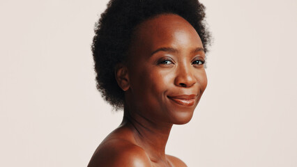 Smile, skincare and portrait of black woman in studio for dermatology, cosmetics and glow. Shine,...