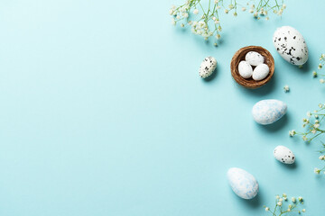 Easter flat lay background with eggs and flowers