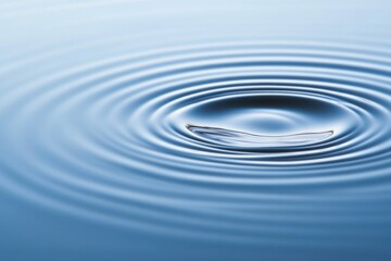 Calm water surface with concentric ripples creating serene atmos