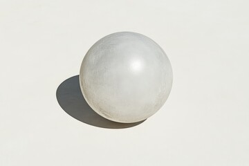 Single, light gray sphere on a plain white background.  Soft, smooth surface.  Simple, geometric form.  Perfect, round shape. Subtle shadow cast