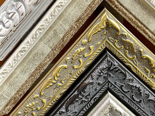 Decorative classic picture frames. Wooden frames background.  Baguette for pictures and frames, folded into a corner.