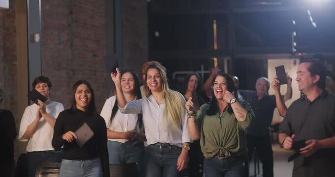 Two women placing offering envelopes into the collection box during church worship, joyful and reverent expressions, diverse community in background participating in spiritual offering