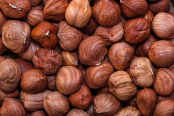 Close-up of whole hazelnuts in shell as a natural background