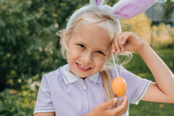 Child with Bunny Ears Celebrating Easter Outdoors