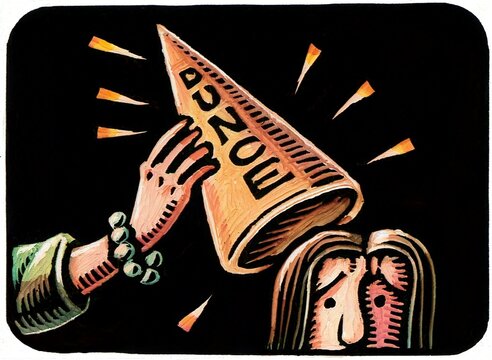 hand placing a dunce cap on a woman's head