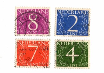 Vintage postage stamps from The Netherlands isolated on a white background.
