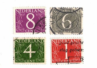Vintage postage stamps from The Netherlands isolated on a white background.