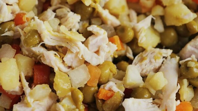 Salad with beef, potatoes and boiled vegetables and canned peas dressing creamy sauce. Classic Olivier salad. . High quality 4k footage