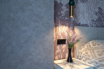 Cozy bedroom detail featuring a modern pendant light, lavender in a vase, and a nature-themed...