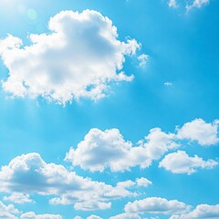 Obraz premium Clear blue sky with fluffy white cumulus clouds floating gently, bright and cheerful atmosphere.