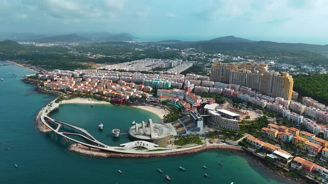 Aerial: Sunset Town panoramic view during the day, a fake Italian city in Phu Quoc Island, Vietnam, pull-out drone shot