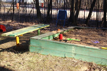 Sandbox and bench in the yard on the playground