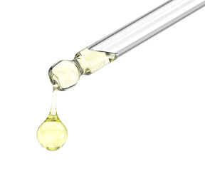 Dripping yellow serum from a pipette, close-up