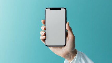 A doctor holds a smartphone with a blank screen, ideal for telehealth and digital healthcare promotions, against a teal background.