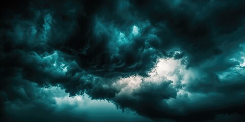 A stormy sky with dark, ominous clouds looming over a landscape.