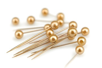 Golden metallic pins on a white background