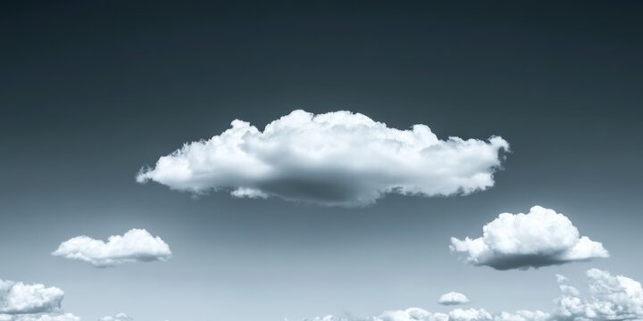 A cloudy sky with fluffy, white clouds against a blue backdrop. A dramatic and soft contrast between the overcast and clear sections of the sky.